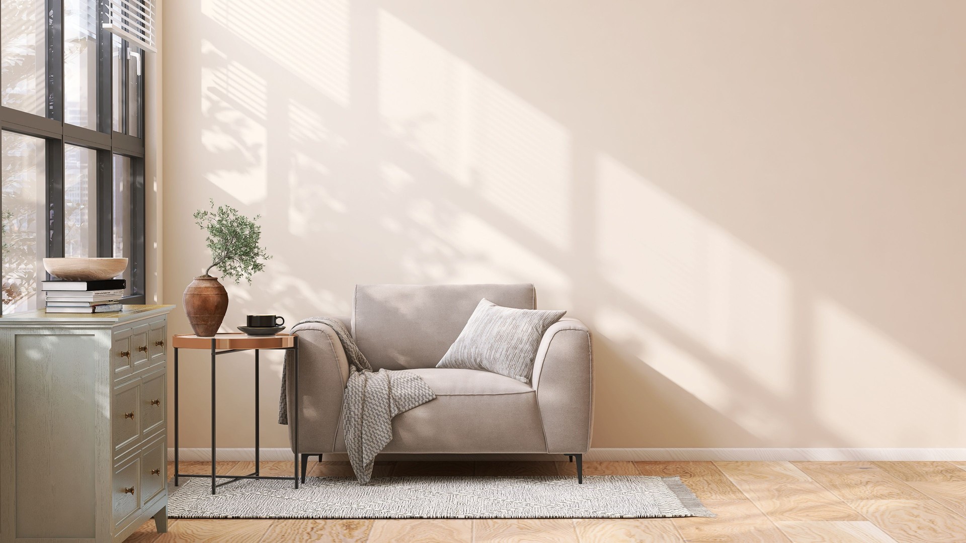 Brown suede leather armchair, brass side table and pastel green wooden cabinet in modern and luxury beige wall and rug on parquet floor room with dappled sunlight from window