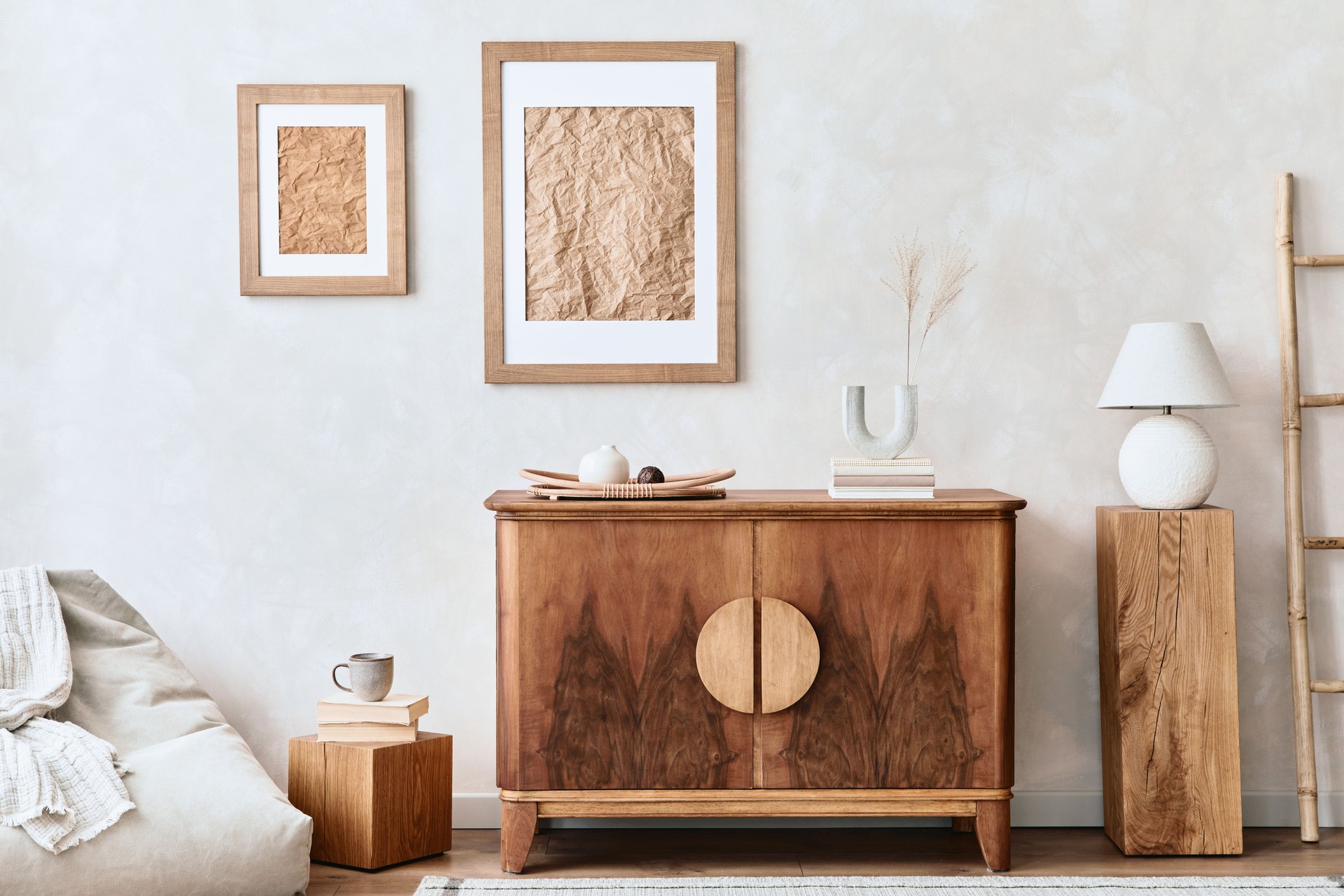 Interior design of neutral living room with stylish retro commode, mock up poster frame, cube, table lamp, decoration and elegant personal accessories in home decor. Template. Japandi concept."r